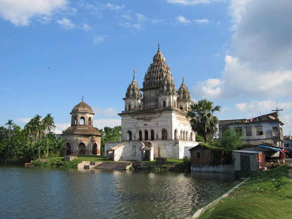 A close-up of intricate 19th-century terracotta art on the Puthia Temple Complex's Govinda Temple.